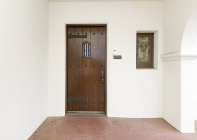 Refinish historic front door on Spanish Villa in Point Loma San Diego