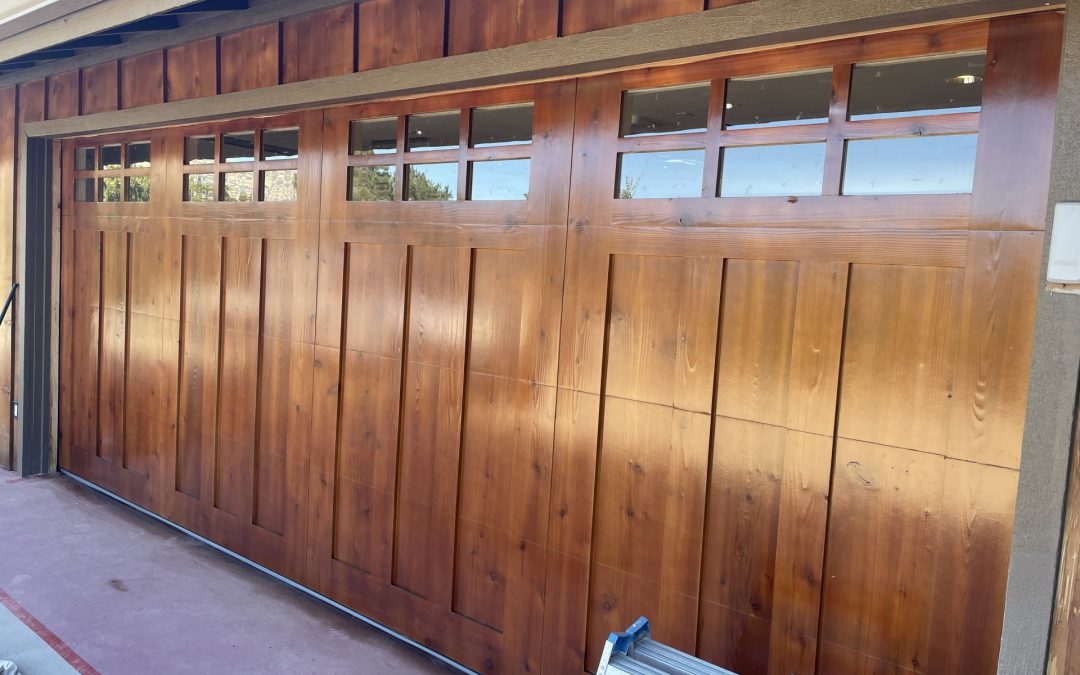Glossy, golden brown finish on wood garage doors